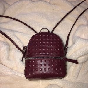 Brand NEW. Burgundy faux leather mini backpack.